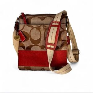 Coach Signature Canvas Swingpack crossbody bag with red trim